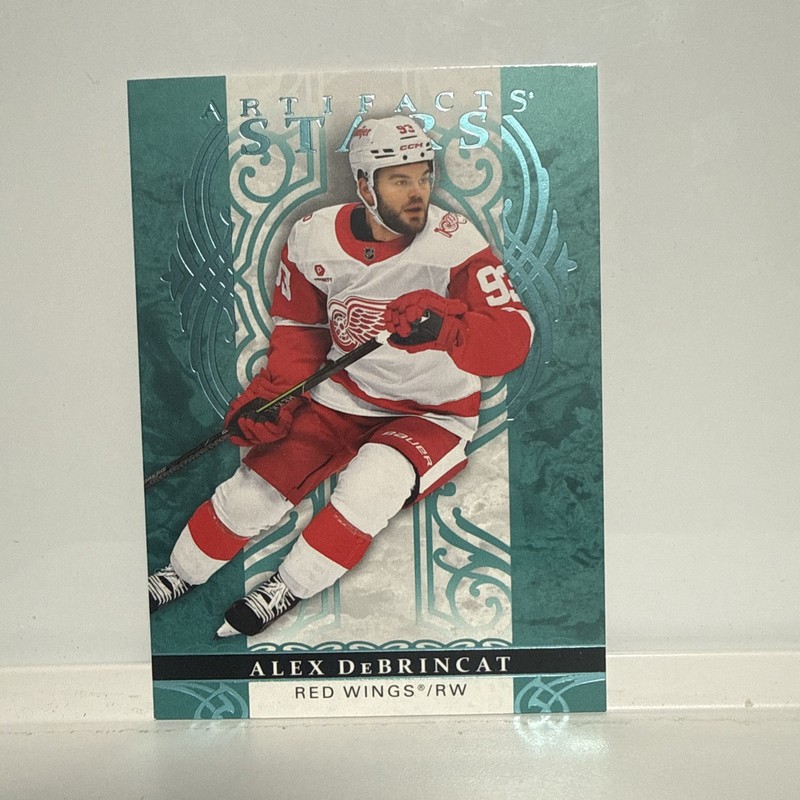 2026-27 Upper Deck Artifacts # 113 Alex DeBrincat /99 Blue Foil Red Wings (RARE)